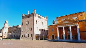 a castle with two towers and a building at Appartamento in campagna vicino autostrada Campogalliano - Carpi in Campogalliano