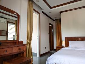 Postel nebo postele na pokoji v ubytování VILLA Siem Reap - eco & local