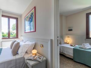 Ένα ή περισσότερα κρεβάτια σε δωμάτιο στο Borgo Tabari Locazione Turistica