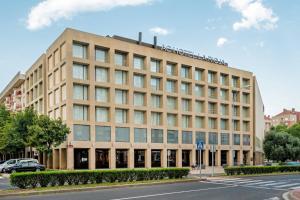 a large building on the corner of a street at AC Hotel La Rioja by Marriott in Logroño +47 photos
