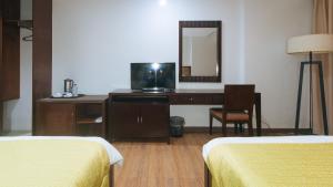 Postel nebo postele na pokoji v ubytování Bliss Hotel San Fernando Pampanga City