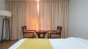 Postel nebo postele na pokoji v ubytování Bliss Hotel San Fernando Pampanga City
