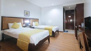 Postel nebo postele na pokoji v ubytování Bliss Hotel San Fernando Pampanga City