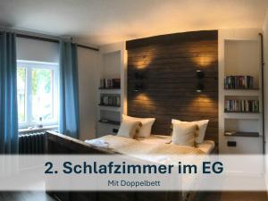 Ein Bett oder Betten in einem Zimmer der Unterkunft Ferienhaus mit Reetdach Gerdi
