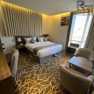 Postel nebo postele na pokoji v ubytování Rafid Hotel Jazan - فندق رفيد جازان