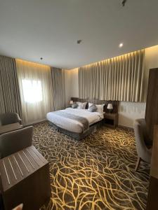 Postel nebo postele na pokoji v ubytování Rafid Hotel Jazan - فندق رفيد جازان