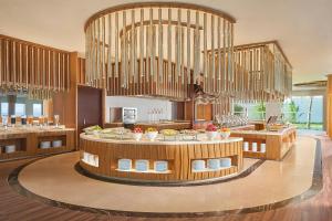 a large kitchen with a table with food on it at Renaissance Danang Hoi An Resort & Spa in Hoi An