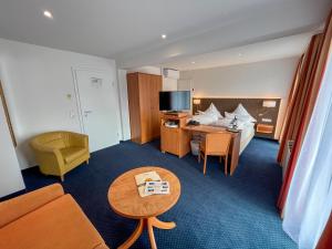 Postel nebo postele na pokoji v ubytování Akzent Hotel Atrium Baden