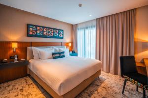 Postel nebo postele na pokoji v ubytování BRĂAT Hôtel + 28 fotografií