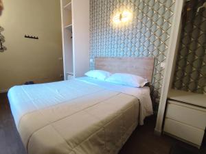 Postel nebo postele na pokoji v ubytování Milazzo23 Guesthouse