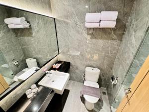Koupelna v ubytování Orchardz Hotel Industri Jakarta Kemayoran