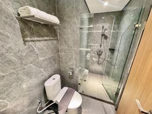 Koupelna v ubytování Orchardz Hotel Industri Jakarta Kemayoran