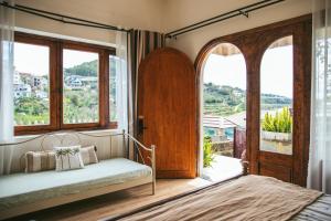 Postel nebo postele na pokoji v ubytování Hè Maison Boutique Stay & café