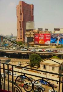 a view of a city with traffic and buildings at oasis Hotel in Cairo