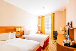 Ένα ή περισσότερα κρεβάτια σε δωμάτιο στο Courtyard by Marriott Pilsen