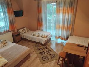 Postel nebo postele na pokoji v ubytování Willa Jakubek Jakub Bobak