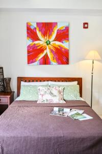 Ein Bett oder Betten in einem Zimmer der Unterkunft Jacana A 1BR Pico de Loro by PTours