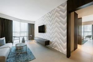 a living room with a couch and a table at Courtyard by Marriott World Trade Centre, Dubai in Dubai