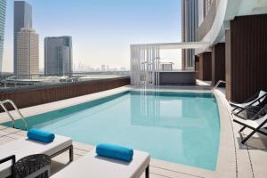 a swimming pool on the roof of a building at Courtyard by Marriott World Trade Centre, Dubai in Dubai