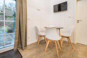 TV a/nebo společenská místnost v ubytování Boardinghaus Grünefeld W5 I by Wooon I P I Küche I Smart TV