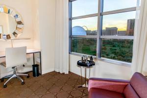 a room with a desk and a chair and a window at Renaissance Las Vegas Hotel in Las Vegas