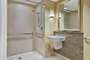 a bathroom with a sink and a shower at Renaissance Las Vegas Hotel in Las Vegas