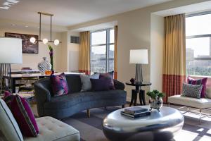 a living room with a couch and a table at Renaissance Las Vegas Hotel in Las Vegas