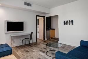 a living room with a couch and a table at Protea Hotel Fire & Ice! by Marriott Durban Umhlanga Ridge in Durban +62 photos