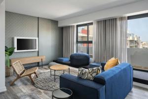 TV a/nebo společenská místnost v ubytování Protea Hotel Fire & Ice! by Marriott Durban Umhlanga Ridge