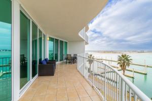 a balcony with a view of the water at Caribe 306 C in Orange Beach