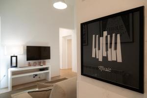 A television and/or entertainment centre at Luxury apt in the heart of city out of ZTL