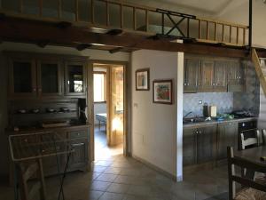 Kuchyň nebo kuchyňský kout v ubytování Villetta a schiera frontemare