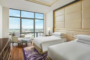 Postel nebo postele na pokoji v ubytování Sheraton Can Tho