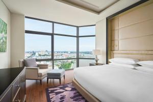 Postel nebo postele na pokoji v ubytování Sheraton Can Tho