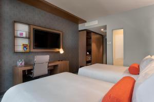 Ein Bett oder Betten in einem Zimmer der Unterkunft Aloft Dublin City