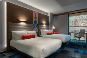 Ein Bett oder Betten in einem Zimmer der Unterkunft Aloft Dublin City