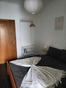 a bedroom with a large bed in a room at Casas Sao Sebastiao in Évora