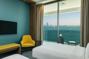 Un ou plusieurs lits dans un hébergement de l'établissement Aloft Palm Jumeirah