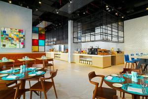 Restaurant ou autre lieu de restauration dans l'établissement Aloft Palm Jumeirah