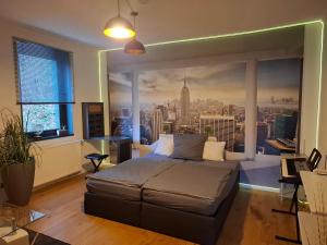a bedroom with a large window with a city view at Ferienzimmer by Riela im ehemaligem Hotel Schöneck in Schönecken