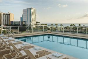 a swimming pool on the roof of a building at AC Hotel by Marriott Clearwater Beach in Clearwater Beach