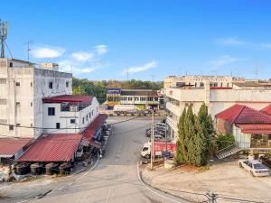 an overhead view of a city street with buildings at Yong Peng homestay 永平民宿- 3 Bedroom Shoplot converted BnB at level 1 &2, for business travellers, Street Parking, WIFI, 1 min to KFC & MCD in Yong Peng