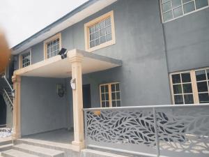 a house with a metal fence in front of it at Bodija Suite Ibadan 3bedroom apartment in Ibadan