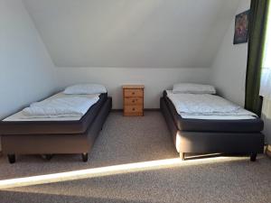 Ένα ή περισσότερα κρεβάτια σε δωμάτιο στο Ferienwohnung im Oberharz