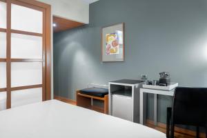 Postel nebo postele na pokoji v ubytování AC Hotel Ponferrada by Marriott