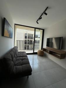 TV a/nebo společenská místnost v ubytování Acogedor apartamento con vista + 9 fotografií