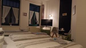Postel nebo postele na pokoji v ubytování Hotel Villa Alice