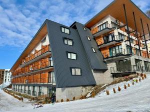 a building on top of a snow covered slope at Your Perfect Ski Base in Bakuriani in Bakuriani