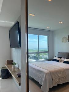 Apartment with direct access to the Sea in CTG客房内的一张或多张床位