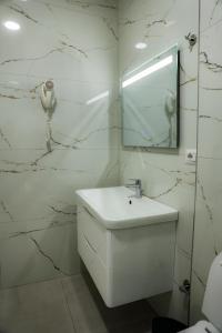 Koupelna v ubytování Hotel Univers Laç